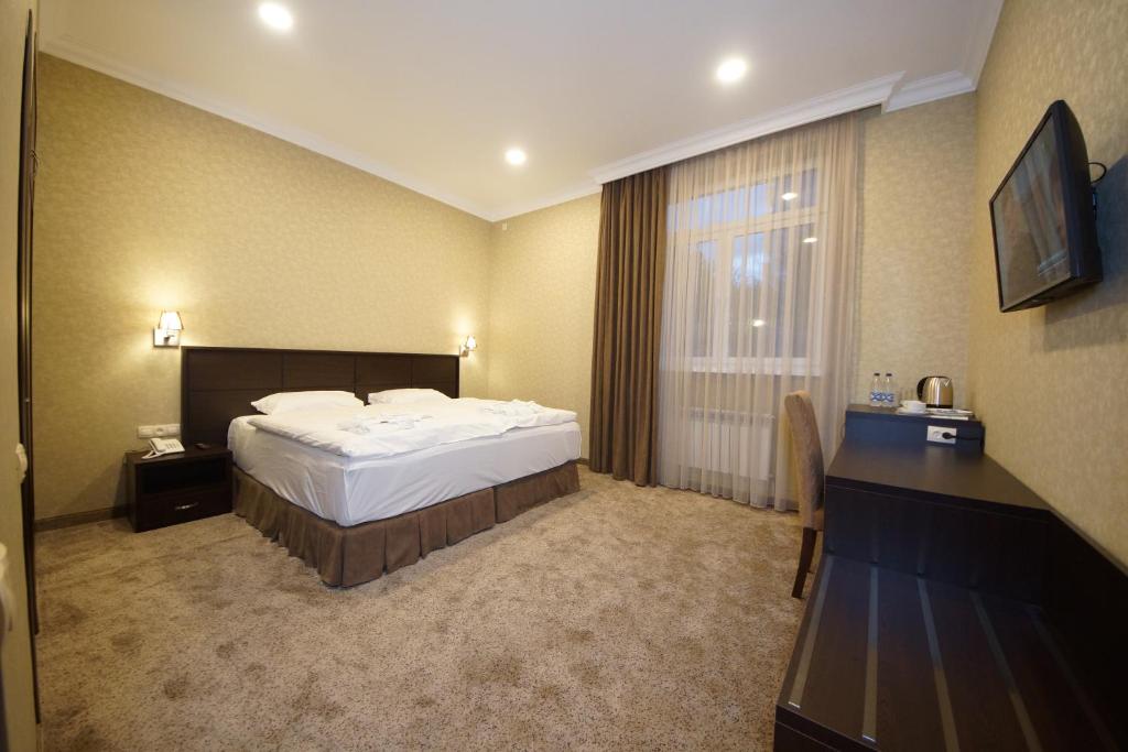 Postel nebo postele na pokoji v ubytování Laguna Hotel