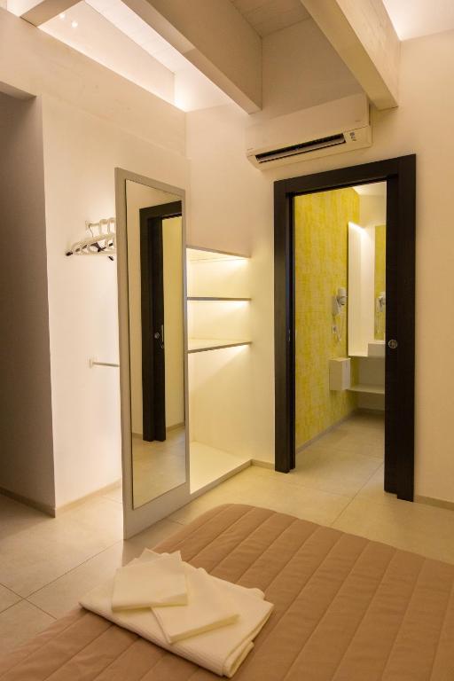 Postel nebo postele na pokoji v ubytování Hotel New Bari