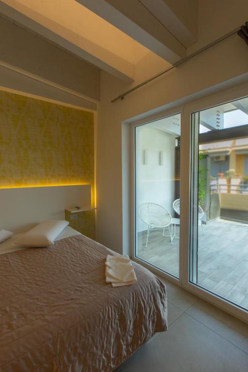 Postel nebo postele na pokoji v ubytování Hotel New Bari