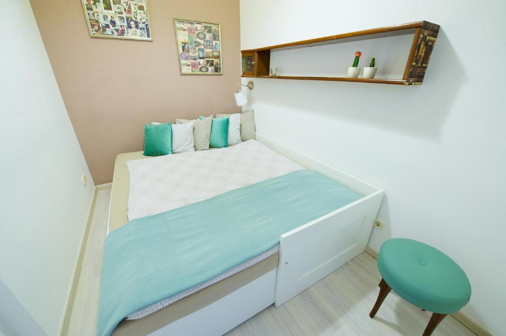 Posteľ alebo postele v izbe v ubytovaní Green Door Family Apartment