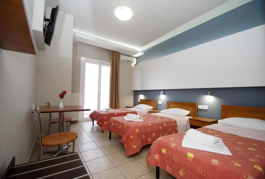 Postel nebo postele na pokoji v ubytování Hotel Rodon