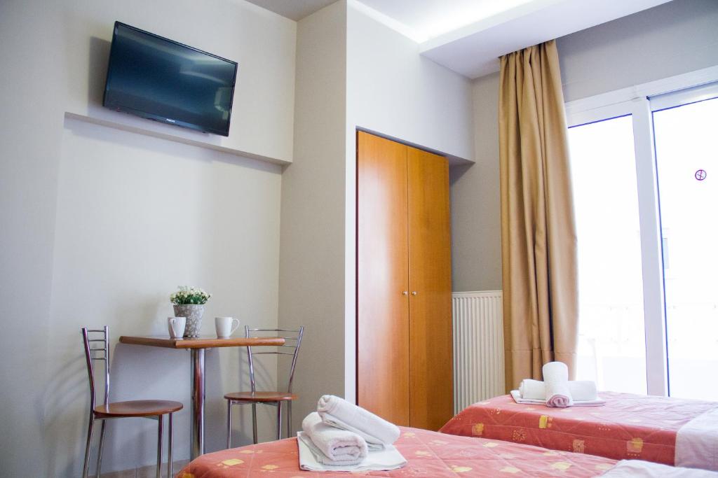 Postel nebo postele na pokoji v ubytování Hotel Rodon