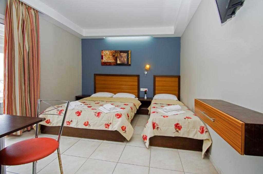 Postel nebo postele na pokoji v ubytování Hotel Rodon