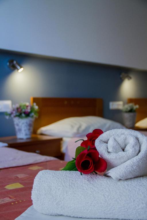 Postel nebo postele na pokoji v ubytování Hotel Rodon