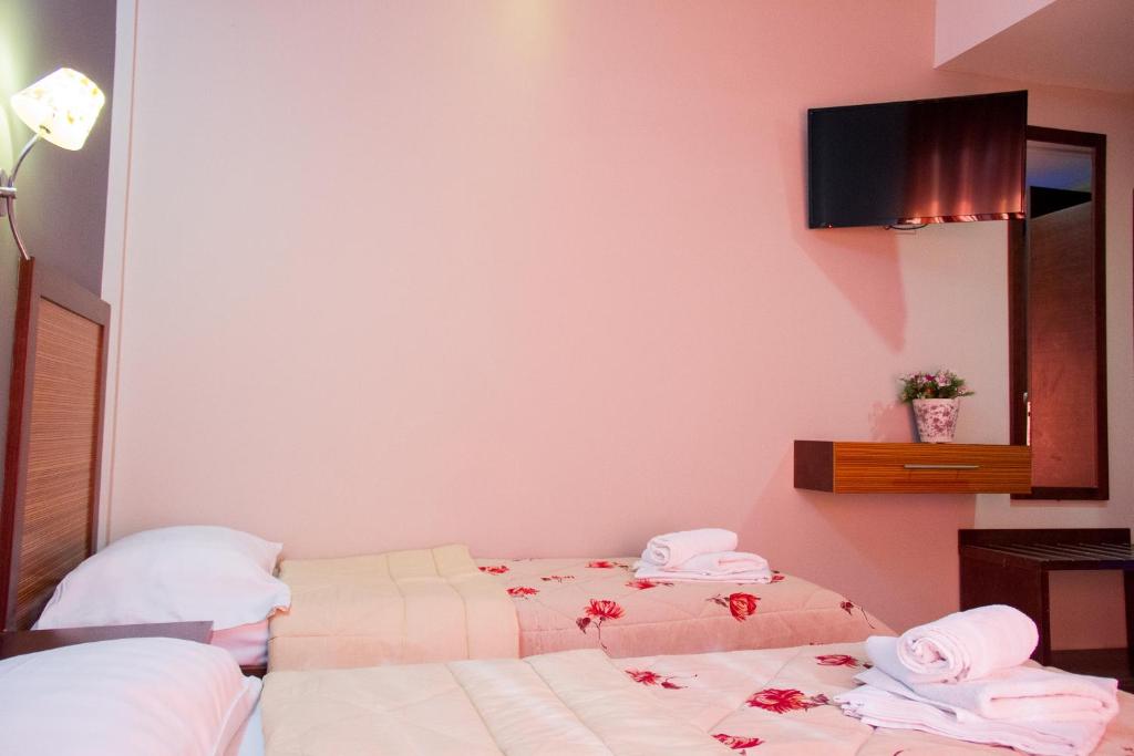 Postel nebo postele na pokoji v ubytování Hotel Rodon