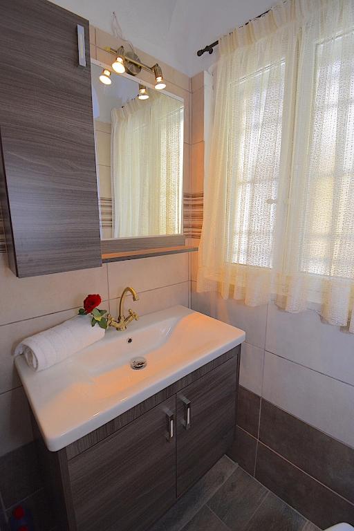 Kúpeľňa v ubytovaní Angiolina Sea View Apartment