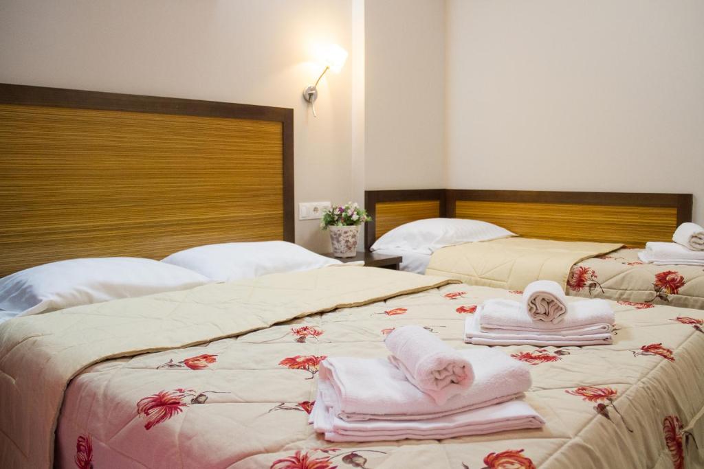 Postel nebo postele na pokoji v ubytování Hotel Rodon