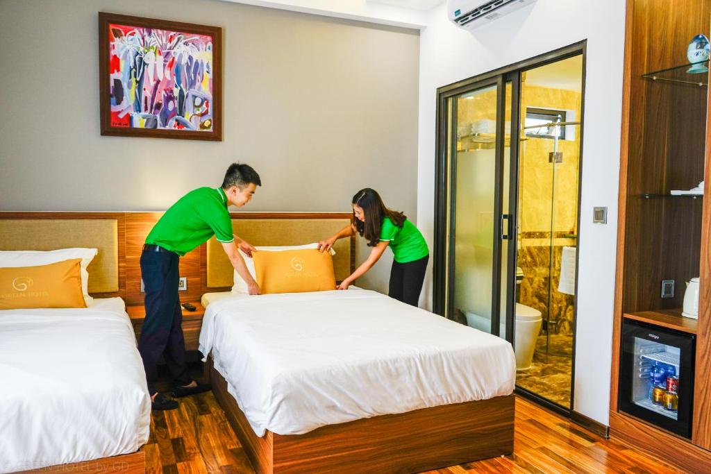Postel nebo postele na pokoji v ubytování Green Hadong Hotel