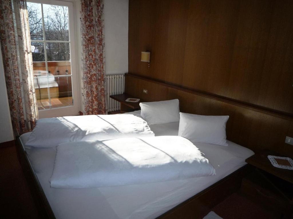 Postel nebo postele na pokoji v ubytování Gasthof Stiegenwirt