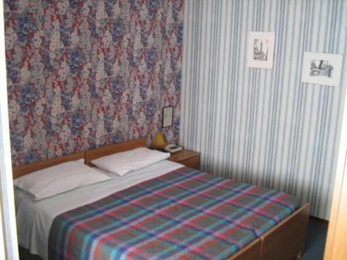 Postel nebo postele na pokoji v ubytování Hotel Da Cesare
