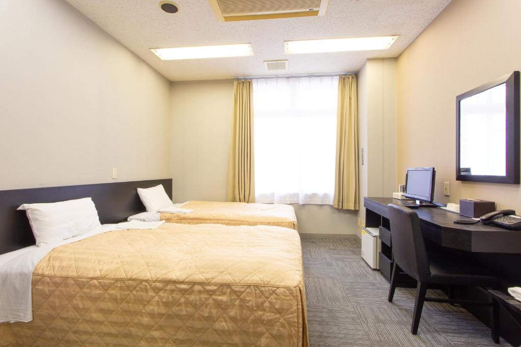 Postel nebo postele na pokoji v ubytování Kuretake Inn Gotemba Inter Gold Cabin