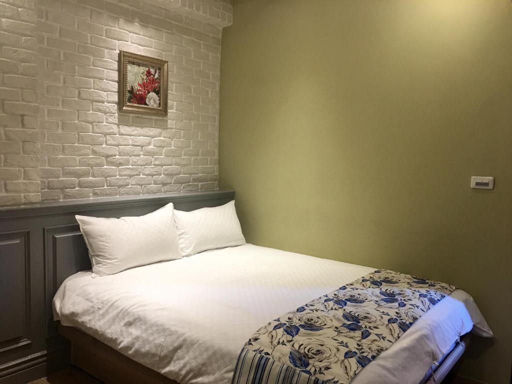 Postel nebo postele na pokoji v ubytování Luck Homestay