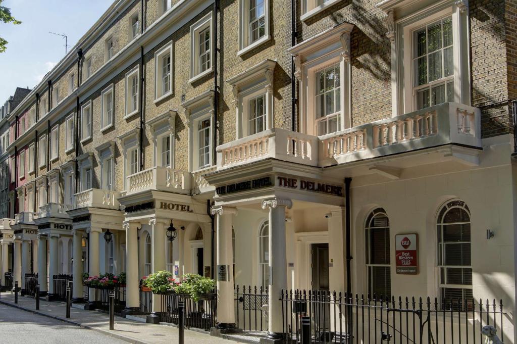 a large white building with a fence in front of it at Best Western Plus Delmere Hotel in London