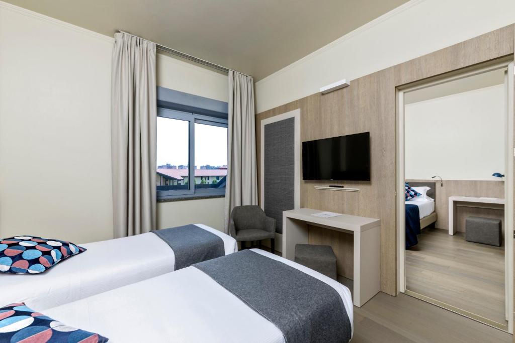 Postel nebo postele na pokoji v ubytování Living Hotel Milano