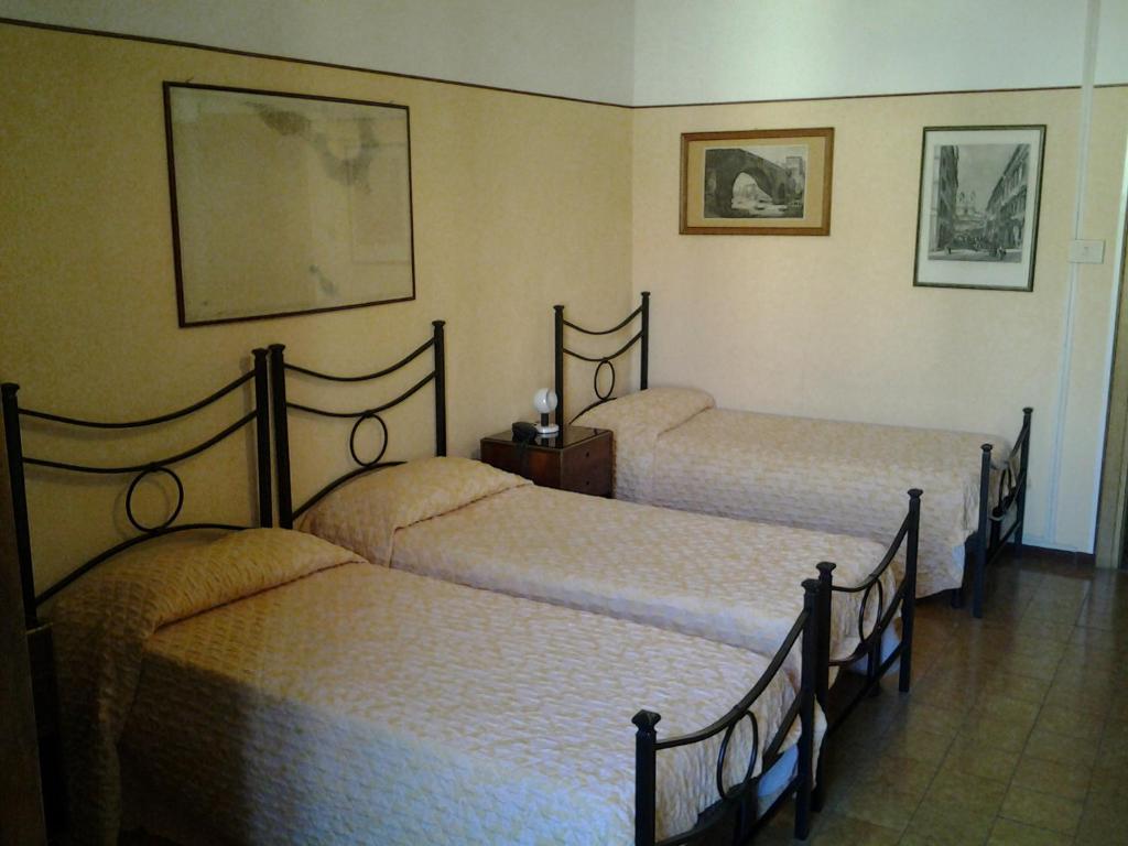 Postel nebo postele na pokoji v ubytování Hotel Touring