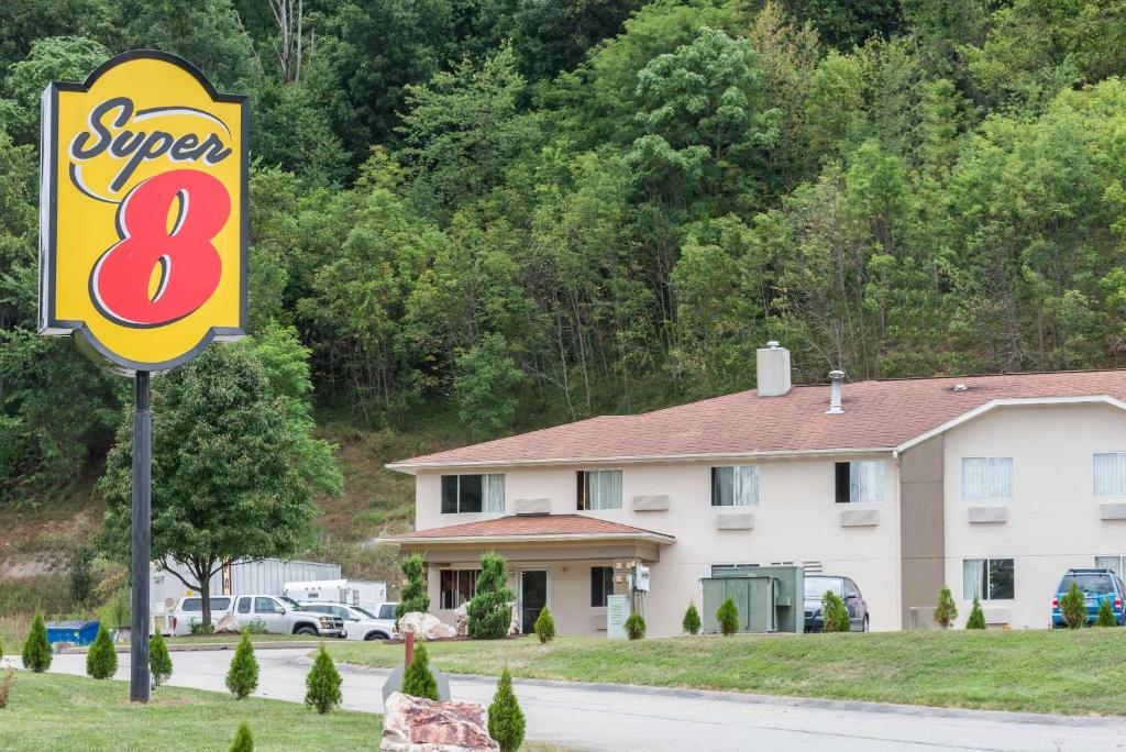 a sign for a super motel in front of a house at Super 8 by Wyndham Pittsburgh/Monroeville in Monroeville