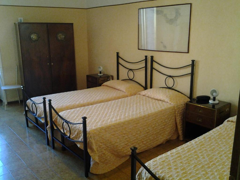 Postel nebo postele na pokoji v ubytování Hotel Touring