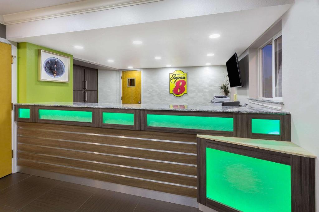 a fish tank in a hospital room with green lights at Super 8 by Wyndham Fortuna in Fortuna