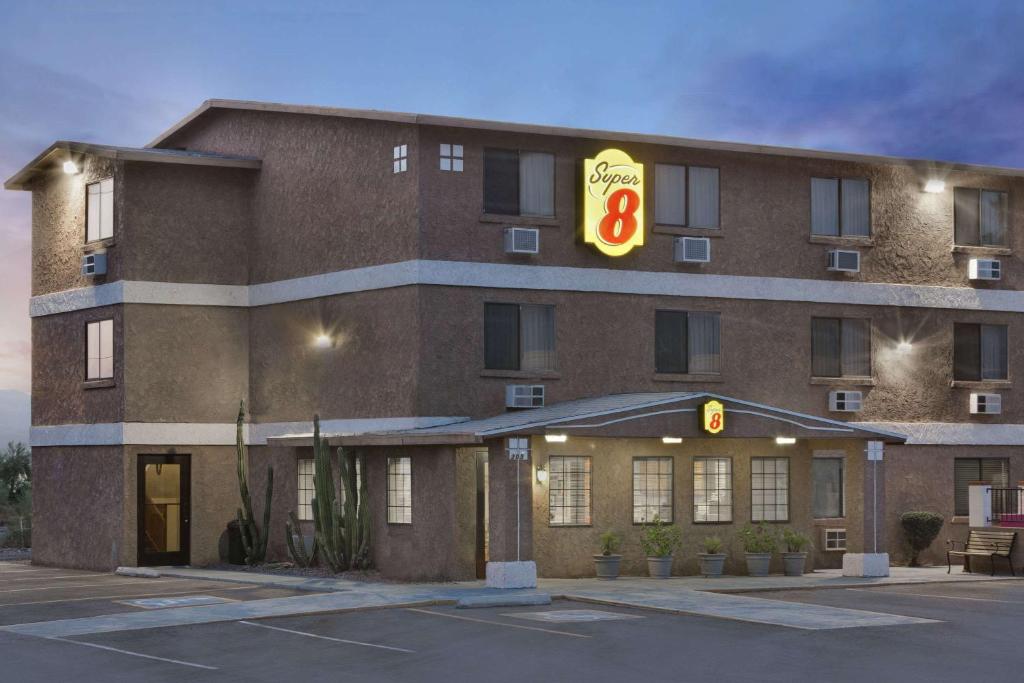 a hotel with a sign on the front of it at Super 8 by Wyndham Lake Havasu City in Lake Havasu City