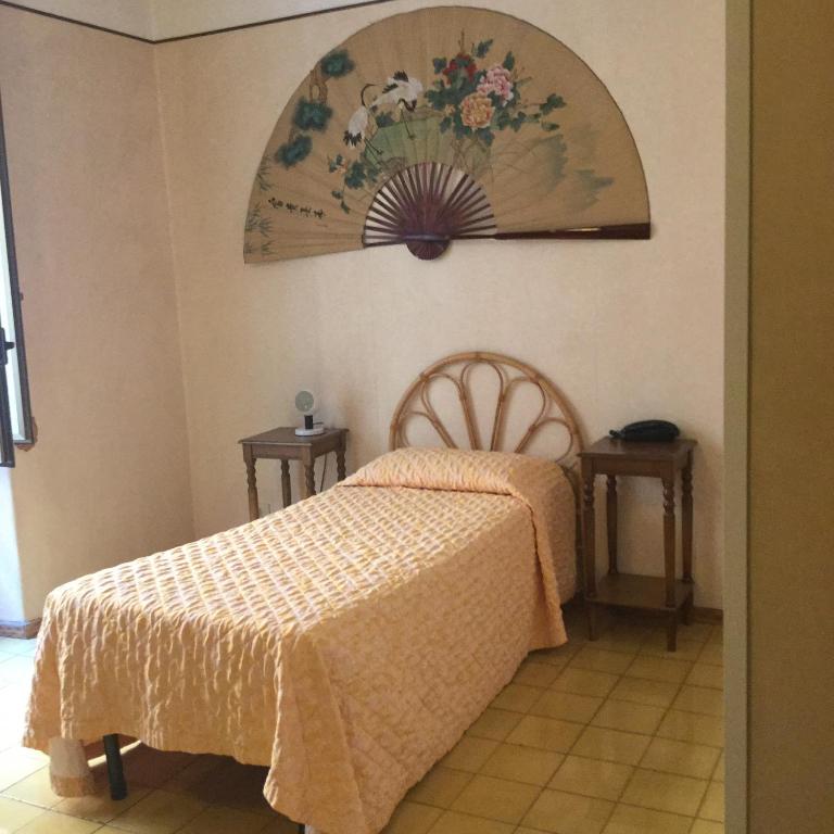 Postel nebo postele na pokoji v ubytování Hotel Touring