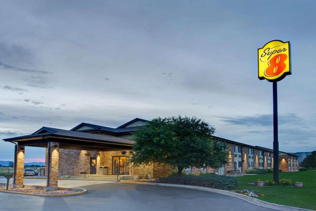 a fast food restaurant with a sign in front of it at Super 8 by Wyndham Fort Collins in Fort Collins