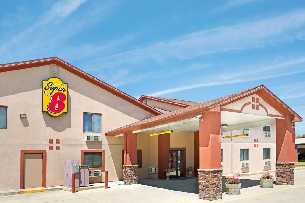 a fast food building with a sign on it at Super 8 by Wyndham Longmont/Del Camino in Longmont