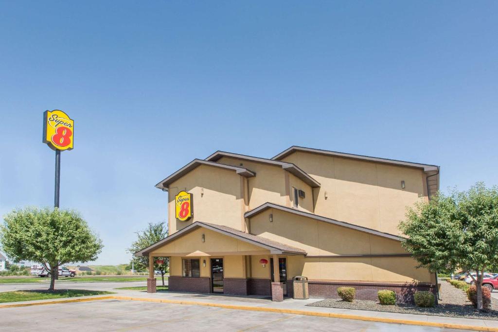 a mcdonalds building with a sign on the side of it at Super 8 by Wyndham Nampa in Nampa