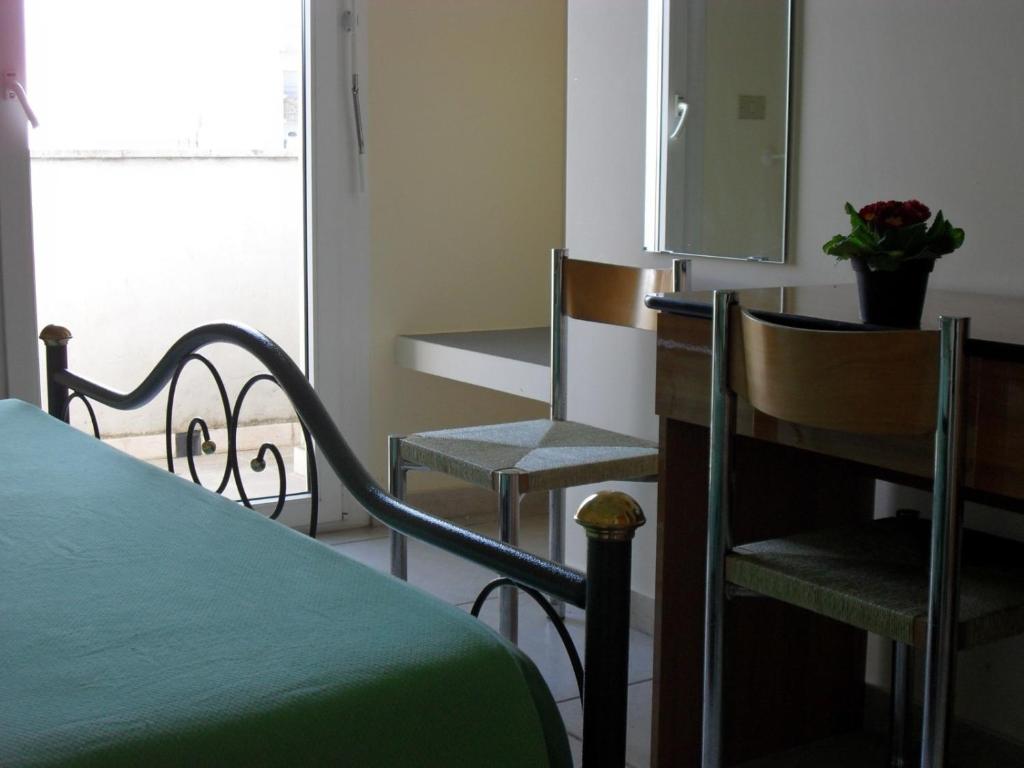 Postel nebo postele na pokoji v ubytování Hotel Esperia