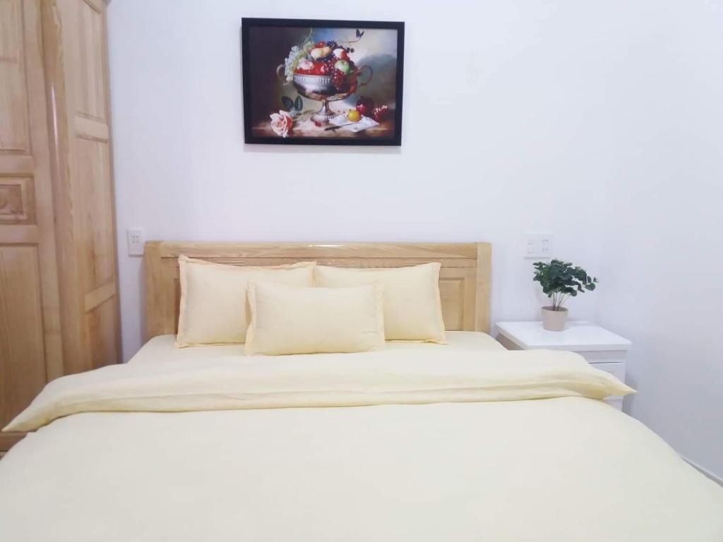 Postel nebo postele na pokoji v ubytování Strawberry Hotel Dalat