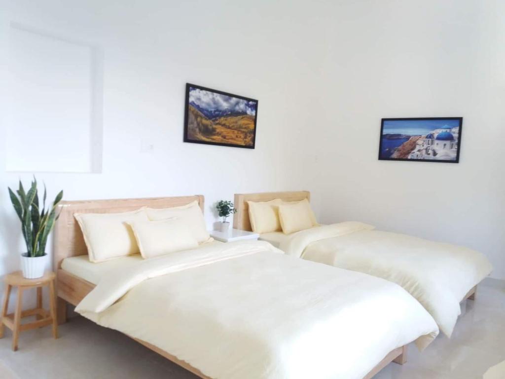 Postel nebo postele na pokoji v ubytování Strawberry Hotel Dalat