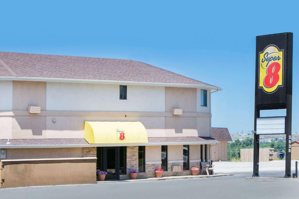 a fast food restaurant with a sign in front of it at Super 8 by Wyndham Casper West by the River in Casper