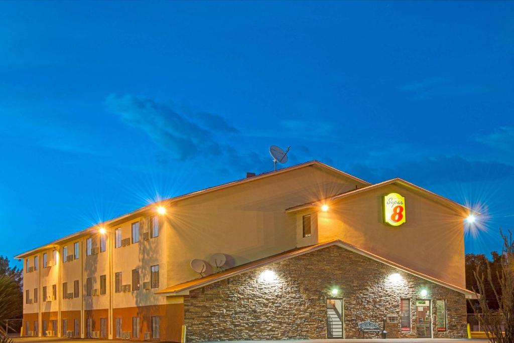 a building with a traffic light on top of it at Super 8 by Wyndham Las Cruces University Area in Las Cruces