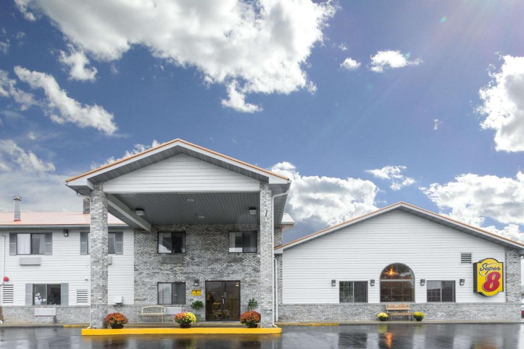 a fast food restaurant with a white building at Super 8 by Wyndham Gallipolis Pt Pleasant Area in Gallipolis