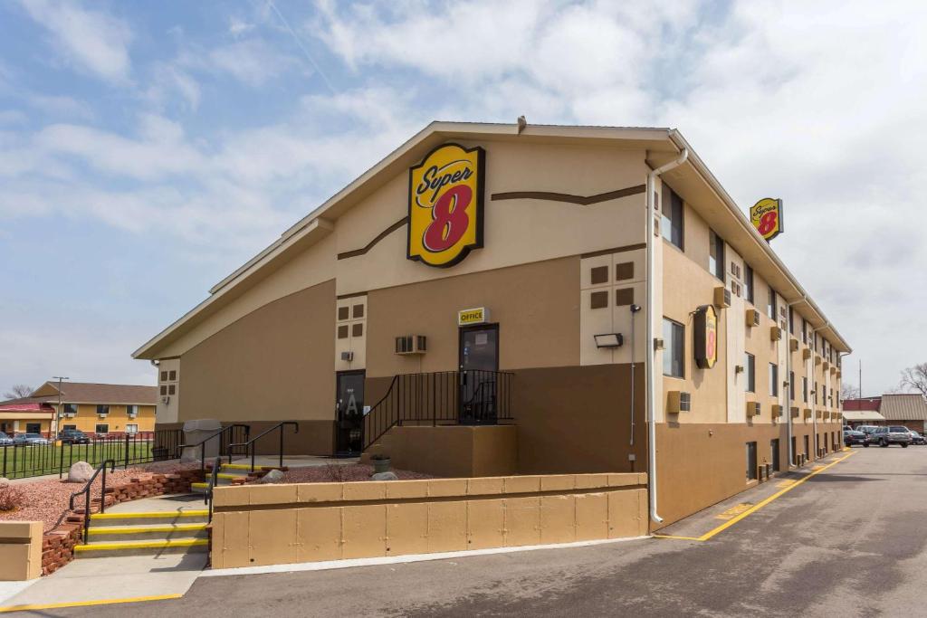 a fast food building with a sign on it at Super 8 by Wyndham Janesville in Janesville