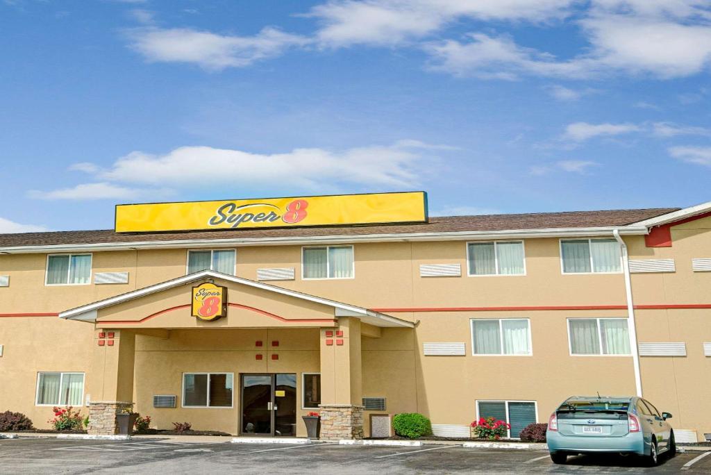 a slow food restaurant with a car parked in front of it at Super 8 by Wyndham Independence Kansas City in Independence