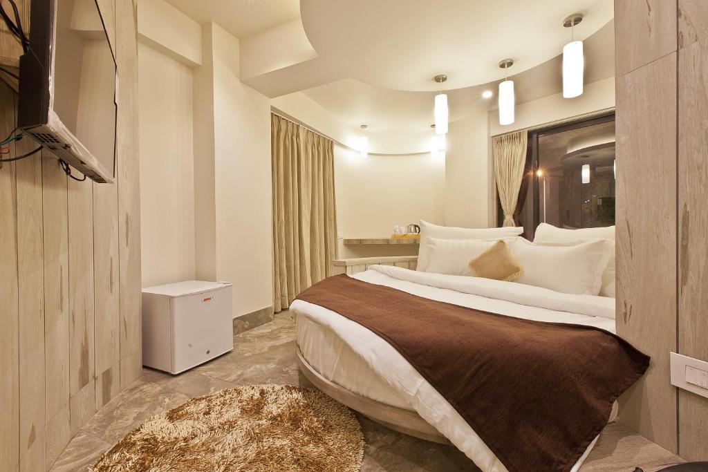 Postel nebo postele na pokoji v ubytování Scenaria Hotel