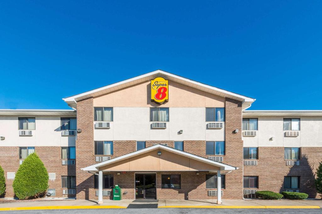 a front view of a hotel with a burger king sign at Super 8 by Wyndham Front Royal in Front Royal