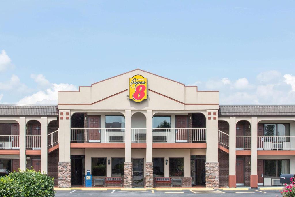a building with a krispy kreme sign on it at Super 8 by Wyndham Wytheville in Wytheville
