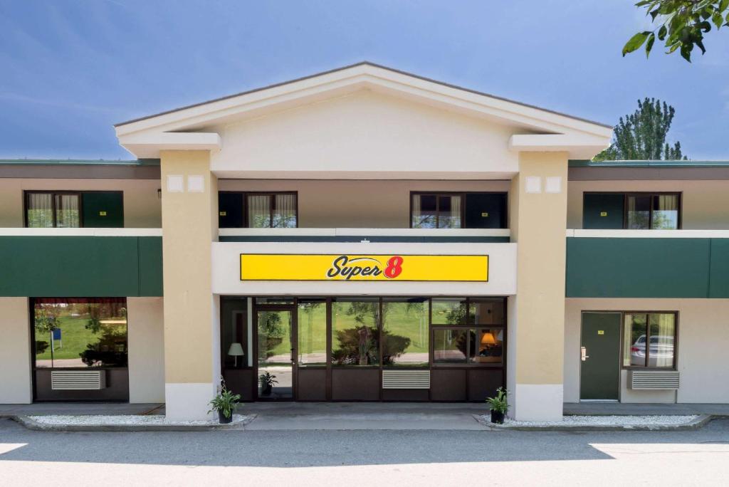 a store front of a building with a sign on it at Super 8 by Wyndham White River Junction in White River Junction