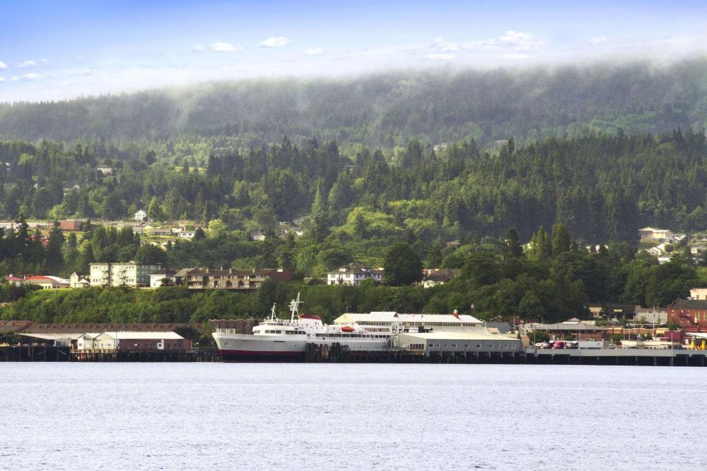 a view of a city from the water at Super 8 by Wyndham Port Angeles at Olympic National Park in Port Angeles