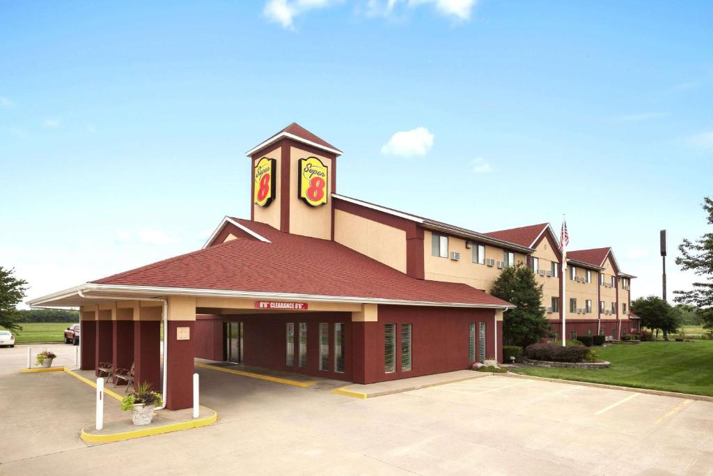 a large building with a clock tower on top of it at Super 8 by Wyndham Salem in Salem
