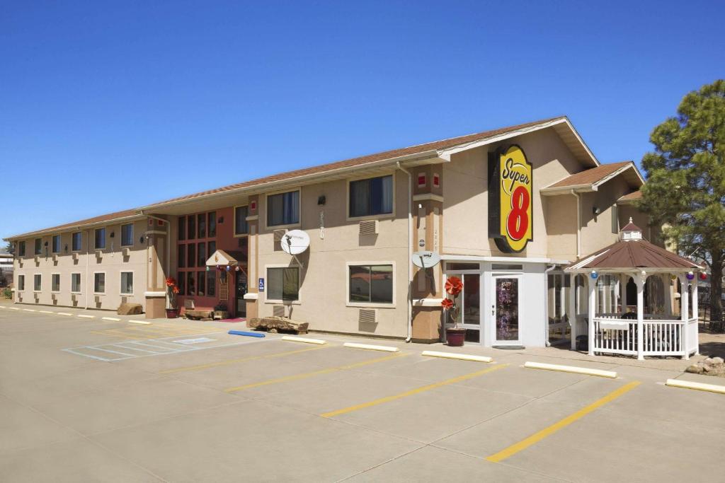 a parking lot in front of a hotel at Super 8 by Wyndham Las Vegas in Las Vegas