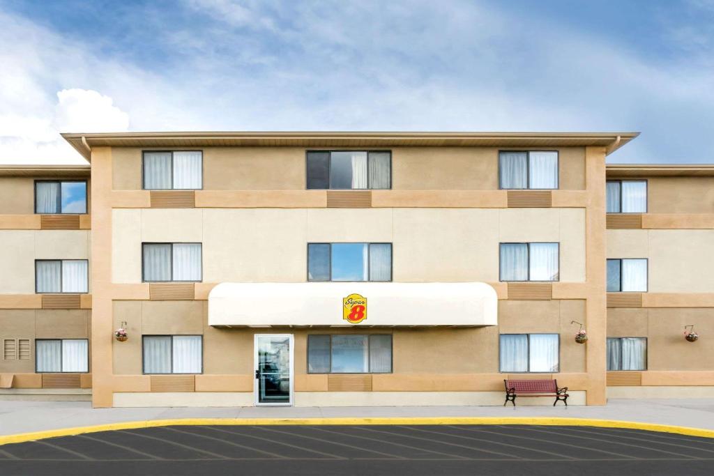 a rendering of a hotel building at Super 8 by Wyndham Cedar City in Cedar City