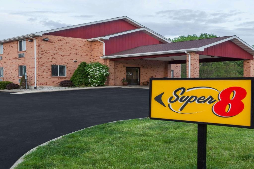 a super sign in front of a building at Super 8 by Wyndham Watseka in Watseka