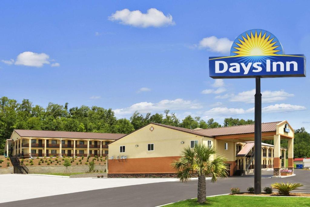 a days inn sign in front of a building at Days Inn by Wyndham Fultondale in Fultondale