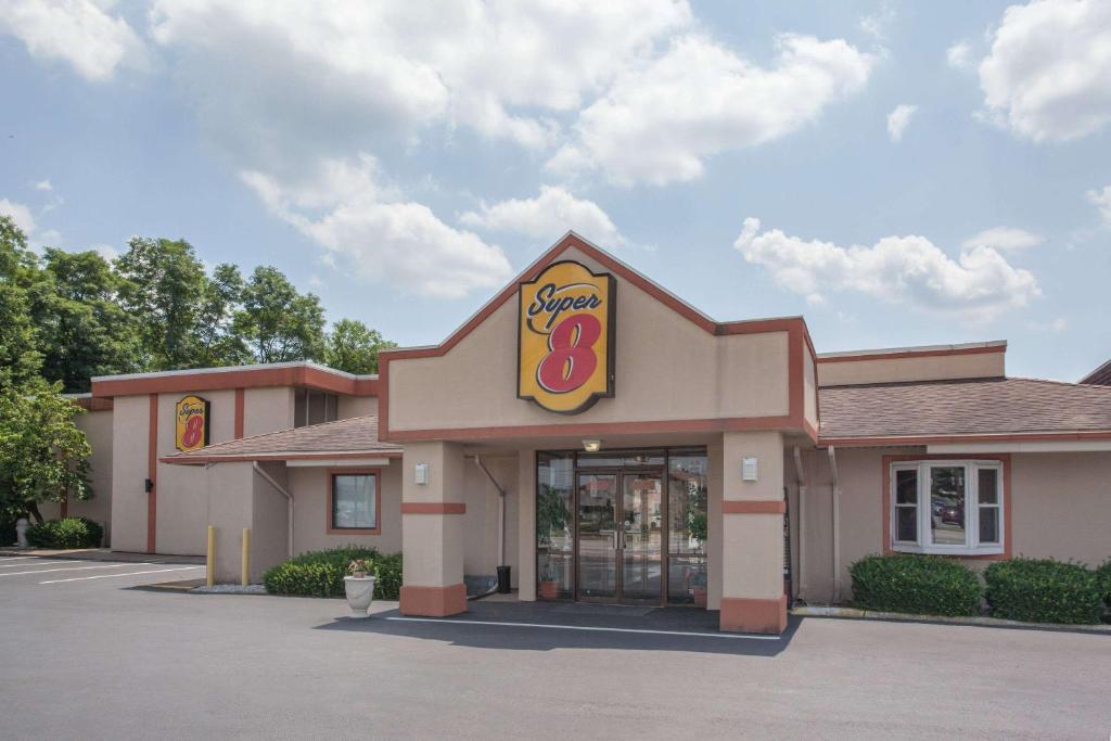 a fast food restaurant with a krispy kreme at Super 8 by Wyndham Carlisle North in Carlisle