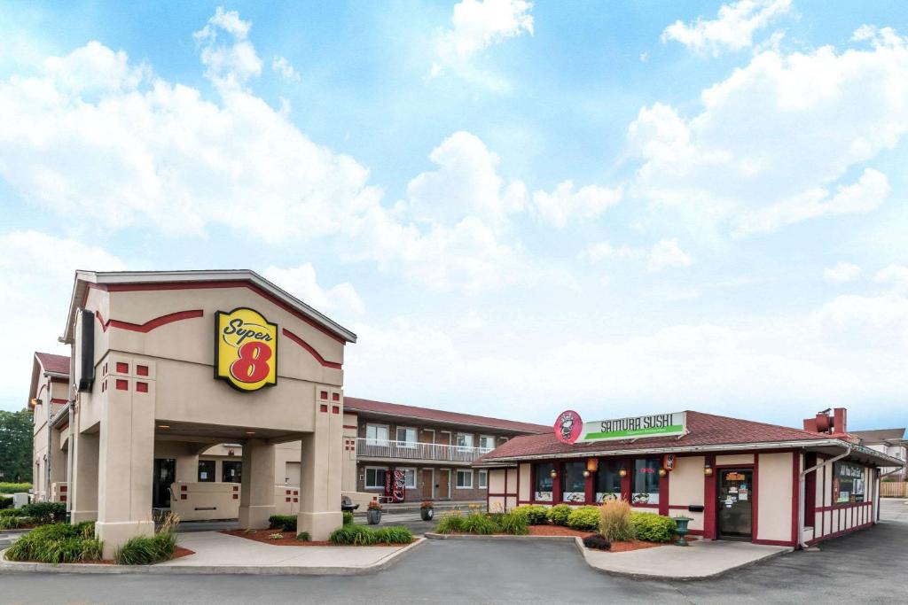 a fast food restaurant with a krispy kreme sign at Super 8 by Wyndham Guelph in Guelph