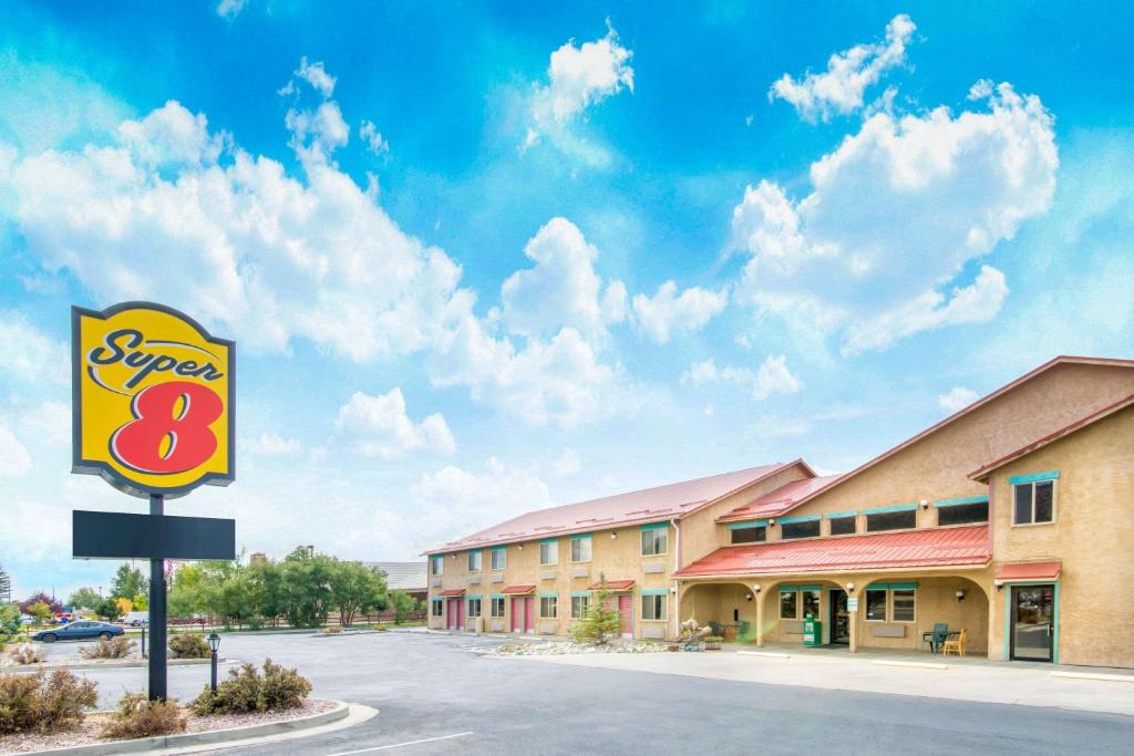 a sign for a super motel in a parking lot at Super 8 by Wyndham Buena Vista in Buena Vista