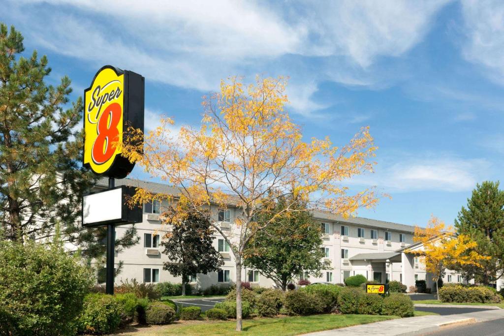 a sign for a fast food restaurant in front of a building at Super 8 by Wyndham Redmond in Redmond