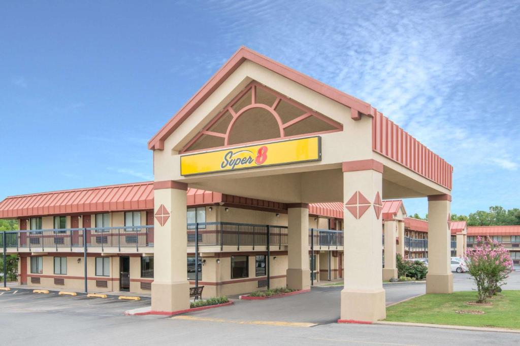 a rendering of the front of a school building at Super 8 by Wyndham Tulsa in Tulsa